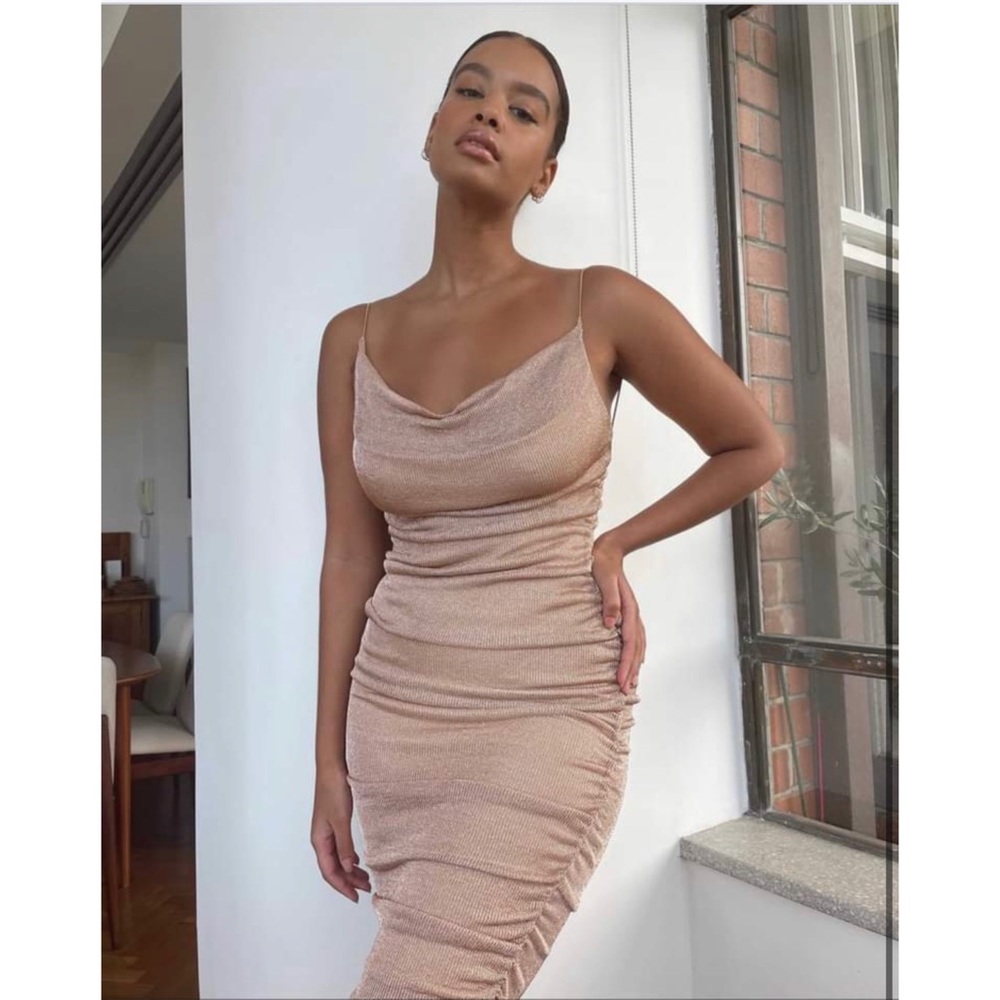 Cowl neck line , spaghetti straps and ruching on the side